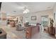 Open concept living area with hardwood floors, comfortable seating, and natural light at 15038 Masthead Landing Cir, Winter Garden, FL 34787