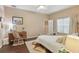 Cozy main bedroom with hardwood floors, desk, and natural light at 15038 Masthead Landing Cir, Winter Garden, FL 34787