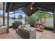 Cozy screened-in patio area with comfortable seating and outdoor grill at 15038 Masthead Landing Cir, Winter Garden, FL 34787
