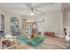 Bright playroom with wooden play structure, colorful rug, and ample natural light at 15038 Masthead Landing Cir, Winter Garden, FL 34787