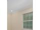 Cozy bedroom with large window providing natural light and neutral walls at 16357 Se 88Th Ct, Summerfield, FL 34491