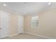 Relaxing bedroom with natural light, serene paint, and tile flooring offering a peaceful retreat at 16357 Se 88Th Ct, Summerfield, FL 34491