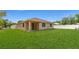 Charming single-story home with a well-maintained lawn and neutral-colored exterior at 16357 Se 88Th Ct, Summerfield, FL 34491