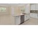 Open kitchen featuring a spacious island, stainless steel appliances, and ample cabinet space at 16357 Se 88Th Ct, Summerfield, FL 34491
