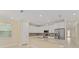 Spacious kitchen with granite counters, stainless appliances, and plentiful white cabinetry at 16357 Se 88Th Ct, Summerfield, FL 34491