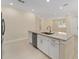 Open-concept kitchen with stainless steel appliances, granite counters, and a central island for cooking and dining at 16357 Se 88Th Ct, Summerfield, FL 34491