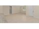 Bright, open living area with neutral walls, tile flooring, and windows, offering a versatile living space at 16357 Se 88Th Ct, Summerfield, FL 34491