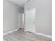Neutral bedroom with two white doors and wood-look flooring at 17044 Goldcrest Loop, Clermont, FL 34714