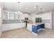 Spacious kitchen with white cabinets, granite countertops, and an island with pendant lights at 17044 Goldcrest Loop, Clermont, FL 34714