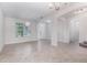 Bright living room with tile floors, neutral paint, and natural light at 17044 Goldcrest Loop, Clermont, FL 34714