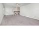 Second floor living area with neutral carpet, a stairwell, and a double door closet at 17044 Goldcrest Loop, Clermont, FL 34714