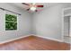 Cozy bedroom with hardwood floors and a large window at 19232 Somerset St, Orlando, FL 32833