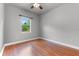 Bright bedroom with hardwood floors and a large window at 19232 Somerset St, Orlando, FL 32833