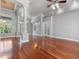Open-concept living room with hardwood floors and ample natural light at 19232 Somerset St, Orlando, FL 32833