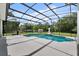 Screened-in pool with ample deck space and beautiful backyard views, perfect for outdoor living at 19232 Somerset St, Orlando, FL 32833