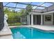 Inviting in-ground pool features pristine water and an elegant statue, creating a serene backyard oasis at 19232 Somerset St, Orlando, FL 32833