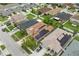 An aerial view of modern houses featuring solar panels on the roofs in a residential neighborhood at 1961 Continental St, St Cloud, FL 34769