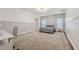 Spacious bedroom featuring neutral tones, carpet flooring, and natural light, perfect for relaxation and comfort at 1961 Continental St, St Cloud, FL 34769