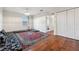 Bright bedroom featuring hardwood floors and ample space with an oriental rug, perfect for comfortable living at 1961 Continental St, St Cloud, FL 34769