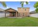 Well-maintained backyard with a covered patio and white fence at 1961 Continental St, St Cloud, FL 34769