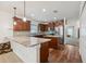 Spacious kitchen featuring granite countertops, stainless steel appliances, wood floors, and ample cabinet space at 1961 Continental St, St Cloud, FL 34769
