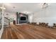 Spacious living room with hardwood flooring, modern lighting fixtures, and a decorative wall at 1961 Continental St, St Cloud, FL 34769