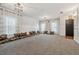 Bright living room with carpet, large windows, modern lighting, and unique contemporary decor at 1961 Continental St, St Cloud, FL 34769