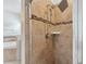 Tiled shower with multiple shower heads and glass enclosure, adding a touch of luxury to your daily routine at 1961 Continental St, St Cloud, FL 34769