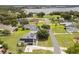 Panoramic aerial view showcasing the home with solar panels in a lakeside community at 2050 Jan Lan Blvd, St Cloud, FL 34772