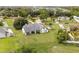Aerial view of the property showcasing the home's layout, extensive lawn, and surrounding neighborhood at 2050 Jan Lan Blvd, St Cloud, FL 34772