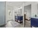 Bright bathroom featuring a double sink vanity, tiled floor and shower, access to backyard and a view into the bedroom at 2050 Jan Lan Blvd, St Cloud, FL 34772