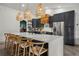 Modern kitchen with an island, pendant lighting, stainless steel appliances, and bar seating at 2050 Jan Lan Blvd, St Cloud, FL 34772