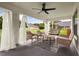 Covered patio with comfortable seating, ceiling fan, and view of the green backyard at 2050 Jan Lan Blvd, St Cloud, FL 34772