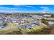 Aerial view of a neighborhood with a pond and well-manicured lawns at 2222 Derwent Dr, Davenport, FL 33896
