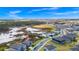 Wide aerial view of neighborhood by a pond at 2222 Derwent Dr, Davenport, FL 33896