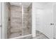 Walk-in shower with gray subway tile and updated fixture at 2222 Derwent Dr, Davenport, FL 33896
