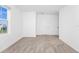 Bright bedroom featuring neutral carpet, a large window, and fresh white walls at 2222 Derwent Dr, Davenport, FL 33896