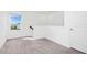 Carpeted bedroom area with natural light, neutral walls, and closet space at 2222 Derwent Dr, Davenport, FL 33896