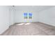 Bright, spacious bedroom featuring neutral carpeting and a pair of windows providing natural light at 2222 Derwent Dr, Davenport, FL 33896
