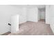 Bright hallway features neutral carpet and fresh white walls at 2222 Derwent Dr, Davenport, FL 33896