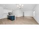 Open concept with an island, stainless steel appliances and hardwood floors at 2222 Derwent Dr, Davenport, FL 33896