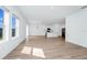Bright open concept living and kitchen area with wood floors and lots of natural light at 2222 Derwent Dr, Davenport, FL 33896