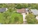 Aerial view of home with a large lot, mature trees, and a long driveway at 2342 Audley St, Oviedo, FL 32765