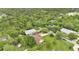 Aerial shot showcases a beautiful property nestled among mature trees, featuring a spacious lawn and well-maintained surroundings at 2342 Audley St, Oviedo, FL 32765