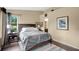 Bedroom with dark wood floors and neutral walls, illuminated by natural light from the window at 2342 Audley St, Oviedo, FL 32765