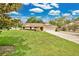 Well-maintained lawn complements this single-story home with a two-car garage and manicured landscaping at 2342 Audley St, Oviedo, FL 32765