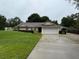 Charming single-story home featuring a well-maintained lawn and a two-car garage, nestled in a serene neighborhood at 2342 Audley St, Oviedo, FL 32765
