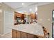 Kitchen with a large island offering seating and a view into the rest of the house at 2342 Audley St, Oviedo, FL 32765