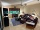 Comfortable living room with a ceiling fan, natural light, and tile flooring, ideal for relaxing and entertaining guests at 2342 Audley St, Oviedo, FL 32765