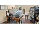 Home office with large desk, a window and a large secure cabinet at 2342 Audley St, Oviedo, FL 32765